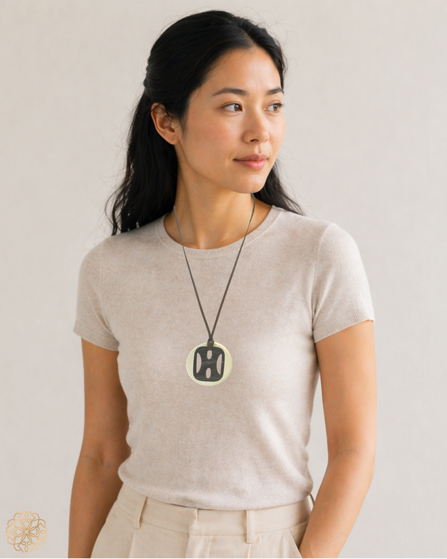 Bold medallion with Asian accent pendant necklace