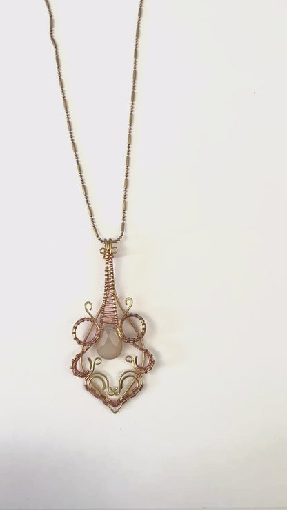 organic tear drop pendant with pale pink gemstone in middle - Sundara Joon