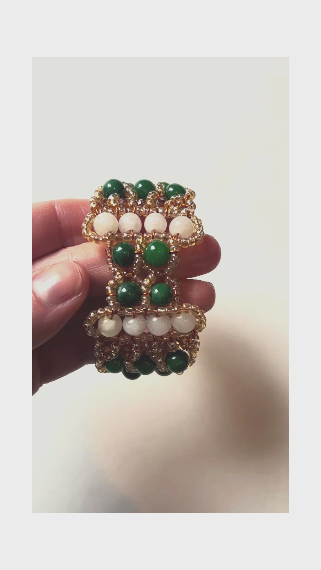 Hand beaded jade bracelet with a nod towards art deco with crystal and seed beads added for visual flare. We think the designers are genious and we got the only one they created in this pattern - a work of art and one of a kind.