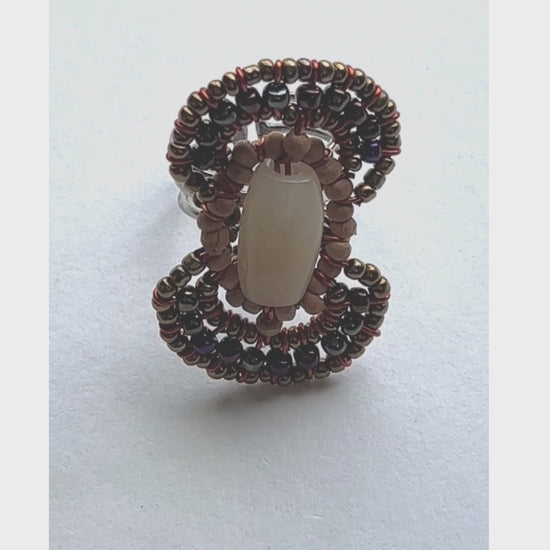 Gemstone surrounded by wood and seed beads in figure 8 pattern - Sundara Joon